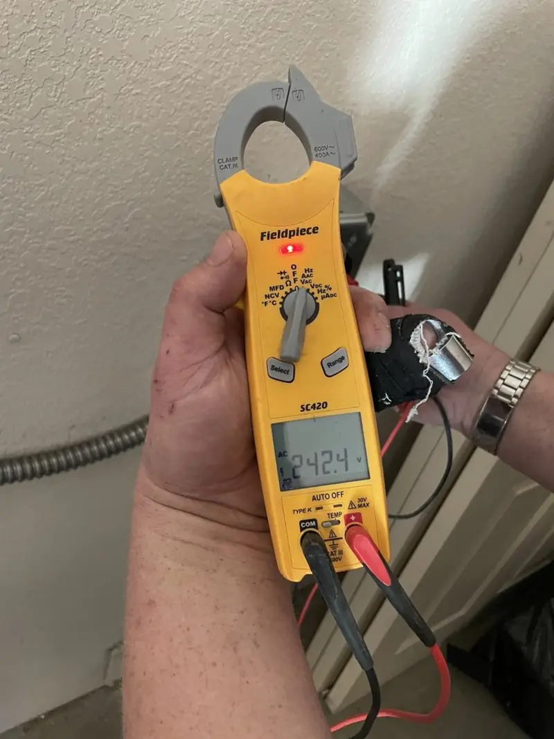 Voltage testing with clamp meter during Whole House Surge Protector in New Hanover